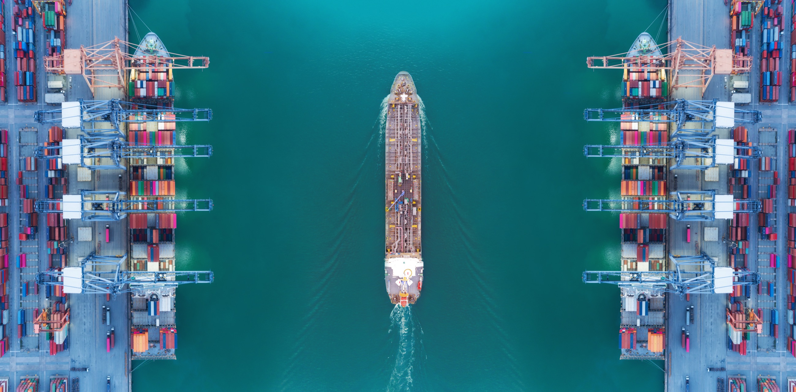 A vessel moving through a port channel between container terminals